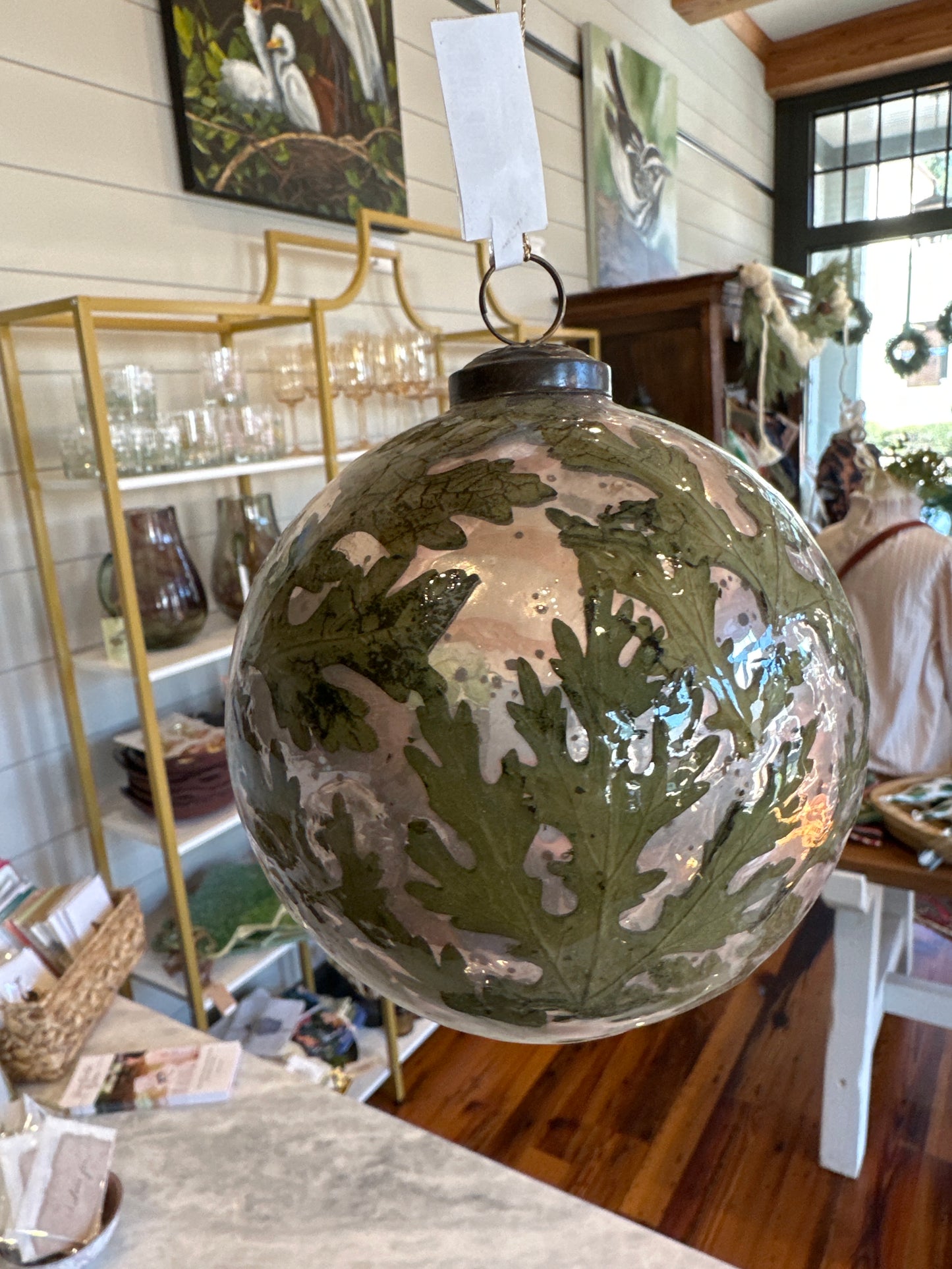 Glass ornament with natural leaves